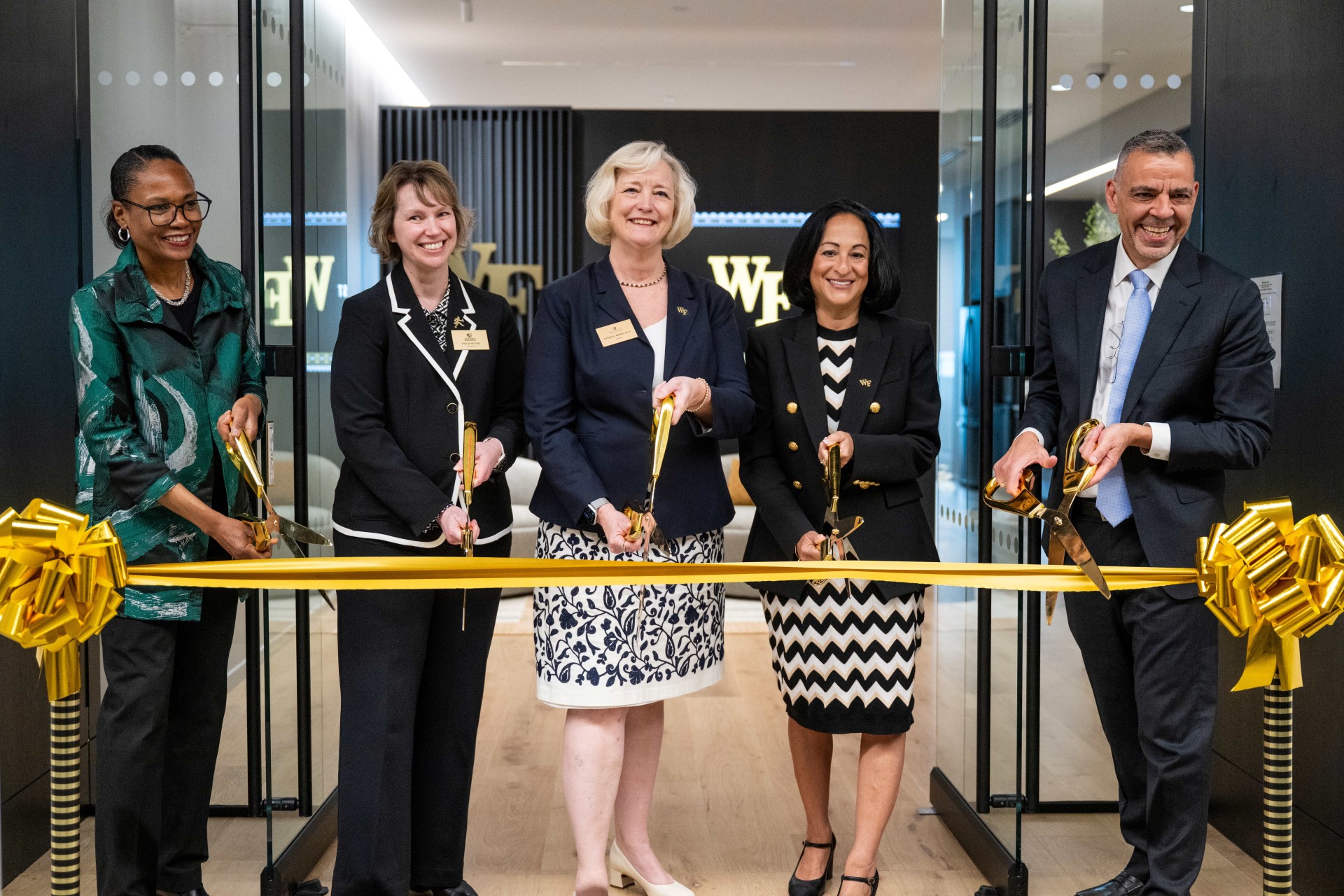 Leaders from Wake Forest University School of Medicine, Wake Forest University and Advocate Health cut a gold ribbon at The Pearl on May 11, 2026.